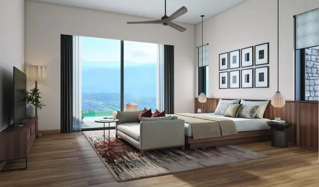 Villa bedroom with a window onto the pool and valley