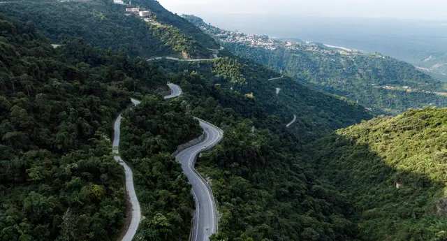 Real drone photograph of the serpentine hill road to Narendra Nagar